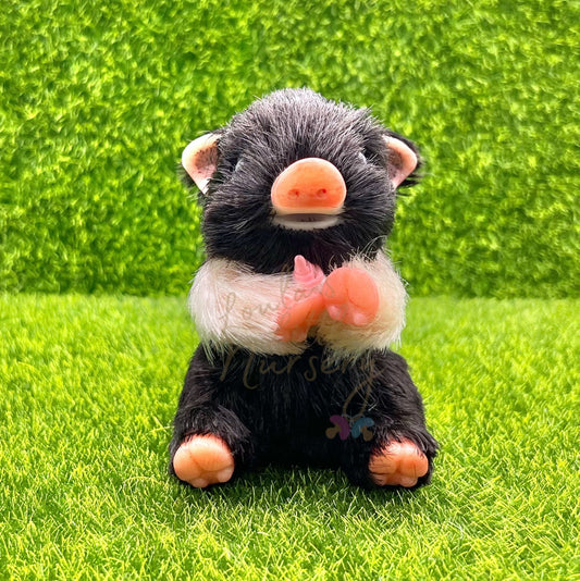 Sitting Oreo Biscuit Piglet Holding Milk Bottle